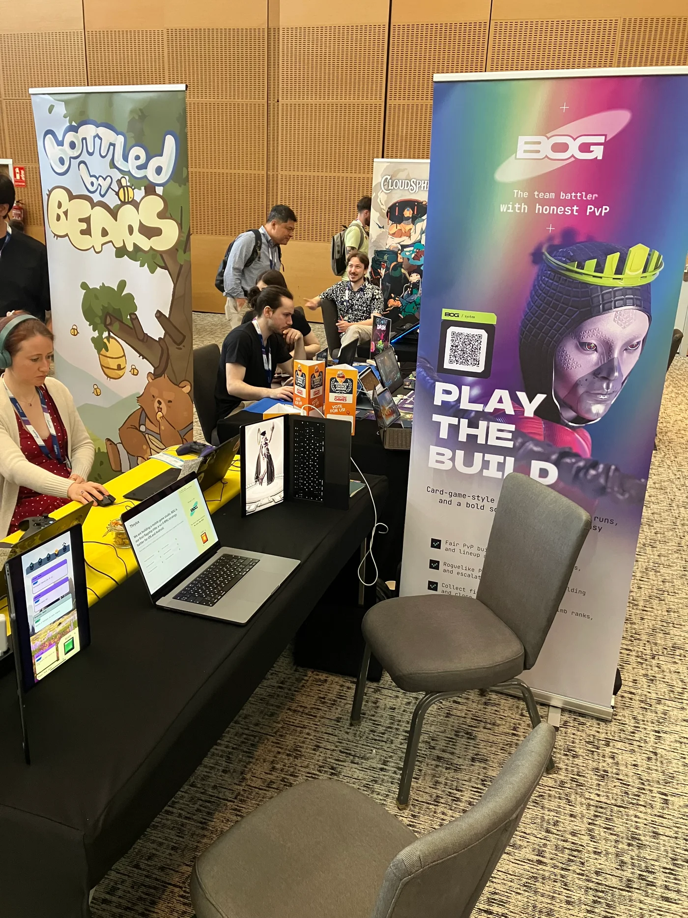BOG’s banner with QR demo access beside the exhibition table in Barcelona